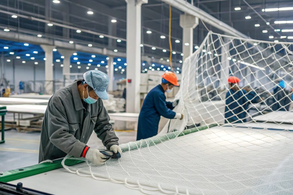 a bustling factory interior with chinese workers a